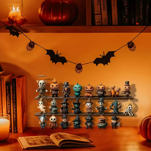 Nærbillede af halloweenfigurer med græskar og hekse fra boksen