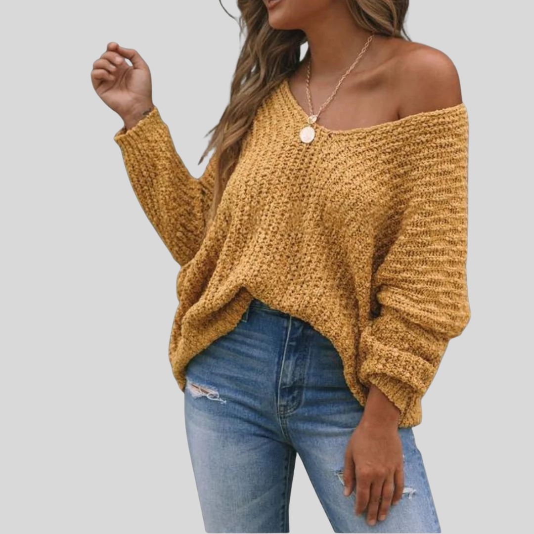SKULDERVIG sweater i brun kombineret med jeans
