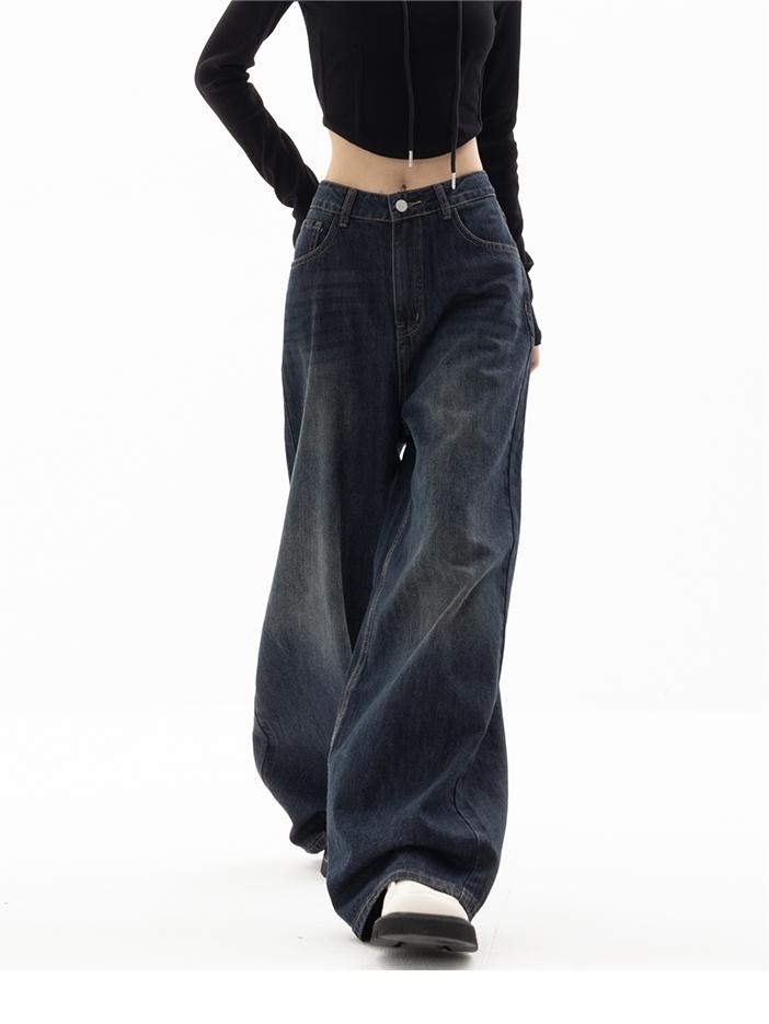 Detalje af femlommedesign på mørkeblå vintage jeans