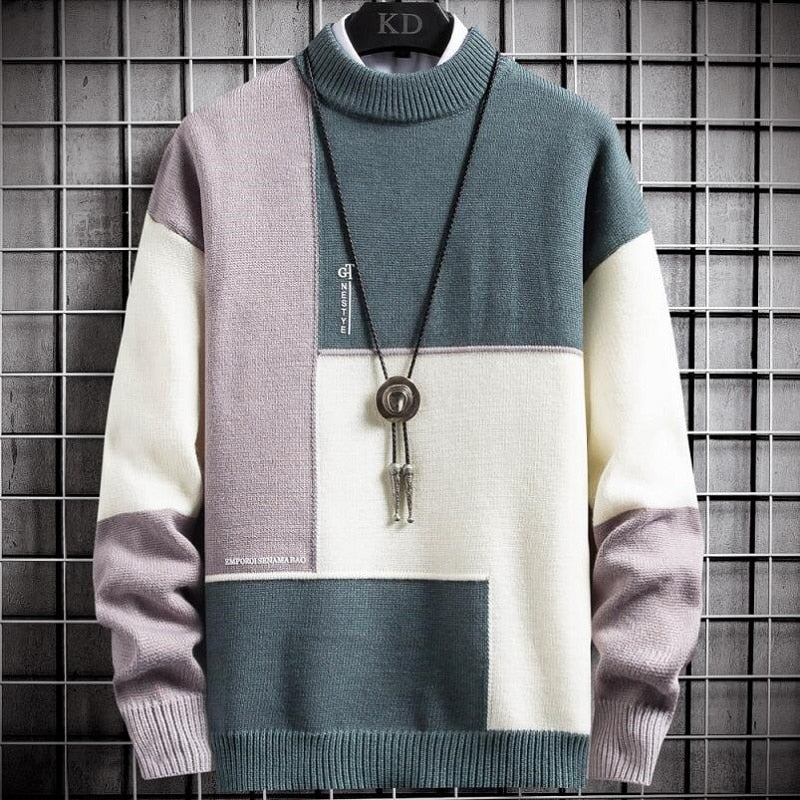 Sort patchwork pullover med elastiske ribkanter ved ærmerne